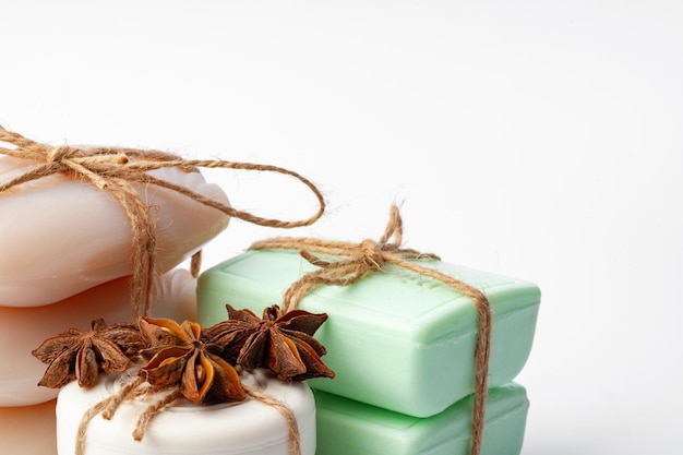 Beige and green soap bars on white background