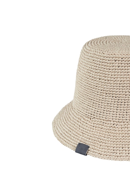 A beige isolated hat made of raffia on a white background Hats mockup no brand top view presentation