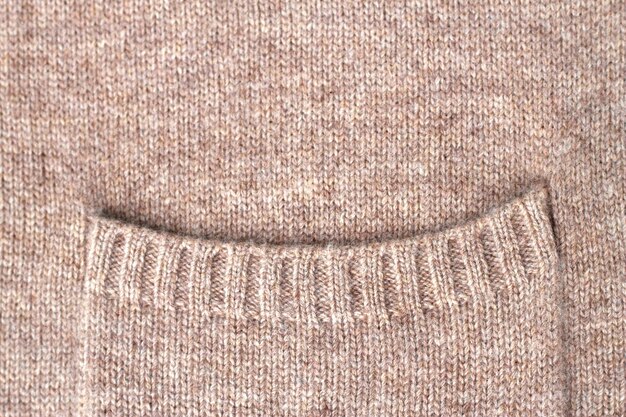 beige knitted pure cashmere wool texture with pocket detail