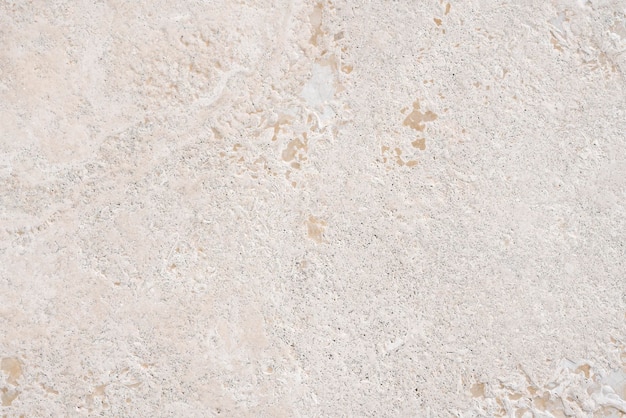 Foto calcare beige simile alla superficie o alla consistenza naturale del marmo per pavimenti o bagni