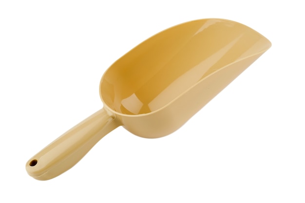 Beige plastic scoop on white insulated background.