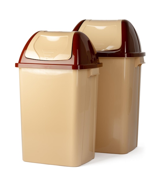 Beige plastic waste bin isolated on white