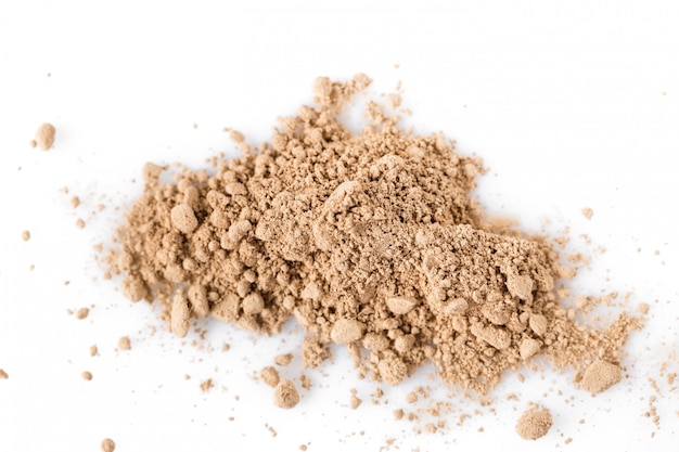 Beige powder for face isolated on white background