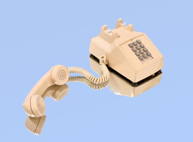 Foto beige retro telefoon met grijze knoppen op de spiegel idee van zakelijke gesprekken