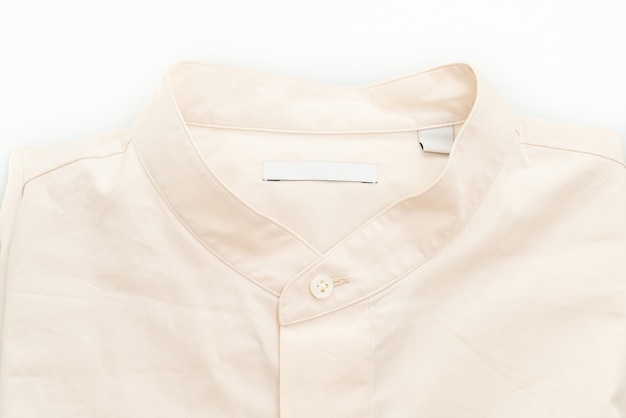 beige shirt closeup isolated on white surface