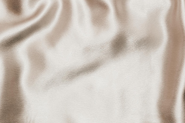 Beige silk fabric texture Satin fashion Background for content