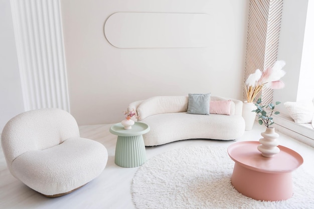 Beige sofa against white wall, empty copy space in simple and\
modern living room interior