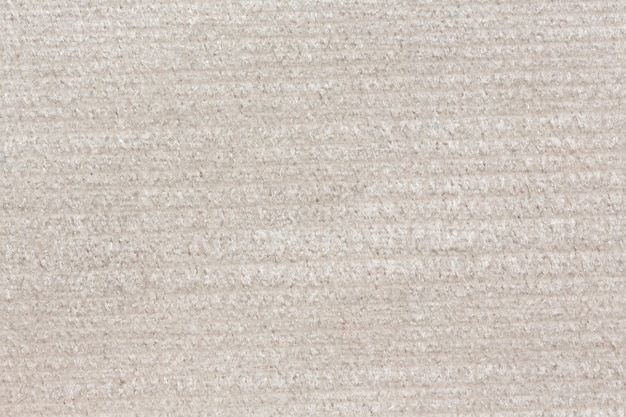 Beige textielachtergrond met schoon oppervlak Beige textieltextuur