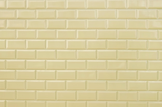 Beige tile brick wall background texture