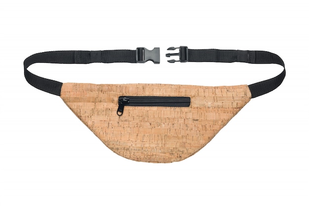 Beige waist bag under a tree isolated on a white background.