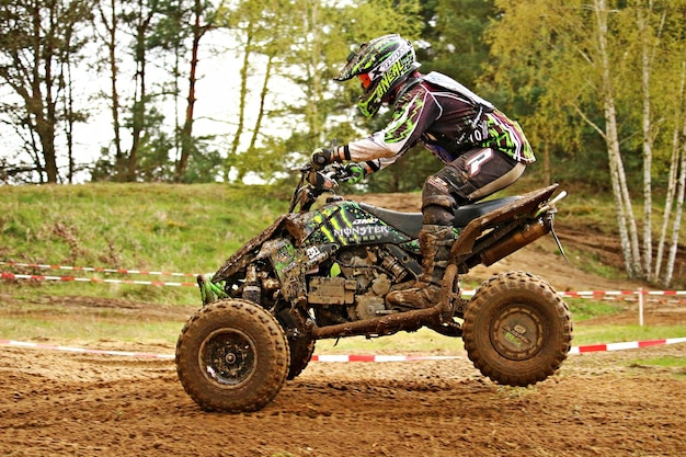 BELA U JEVICKA CZECH REPUBLIC JULY 23 Unidentified racer rides a quad motorbike in the Cross racing Cup 2011 on July 23 2011 near the town of Jevicko Czech Republic