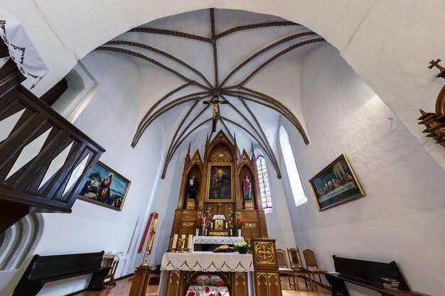 BELARUS AUGUST 2019 interior dome and looking up into a old gothic or baroque catholic church ceiling and vaulting and altar