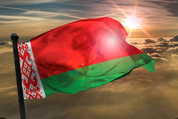 Photo the belarus flag 3d rendering flag ghana on a sun backortund