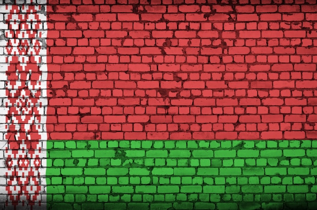 Belarus flag is painted onto an old brick wall