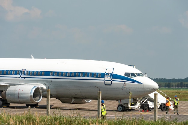 Belarus Minsk July 3 2021 Emergency landing of the aircraft An act of air piracy and terrorism The plane is on the runway Passengers leave the cabin of the aircraft