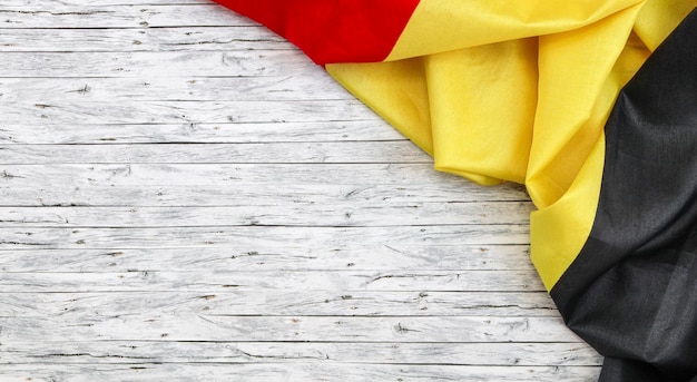 Belgian flag on a wooden table