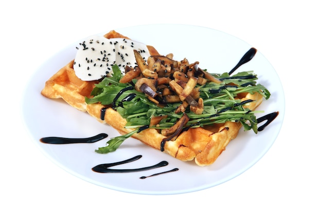 Belgian waffle with croutons,  greens and cheese, isolated image on white background.