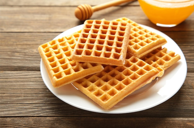 Belgian waffles. Belgian waffles with honey and milk. Freshly baked Belgian waffles.