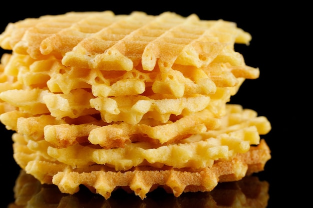 Belgian waffles on a black background Viennese wafers on an empty