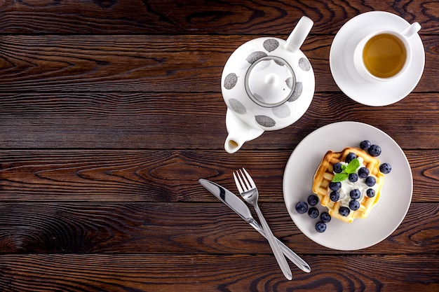 Belgian waffles on dark wooden