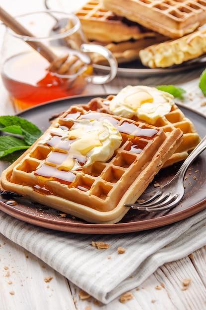 Belgian waffles served with butter and honey