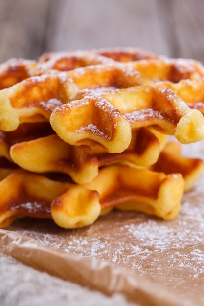 Belgian waffles sprinkled with powdered sugar