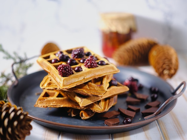 Belgian waffles with berries and chocolate