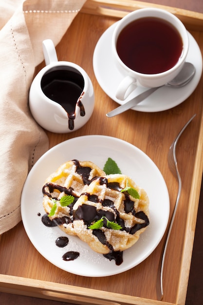 Belgian waffles with chocolate and powder sugar