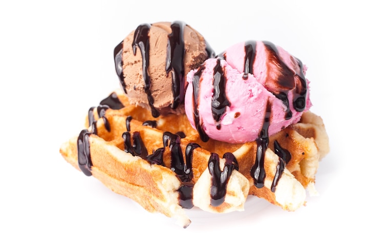 Photo belgian waffles with ice-cream on white background