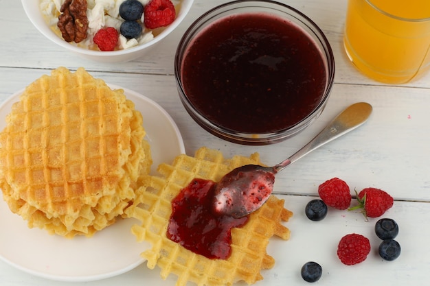 Belgian waffles with raspberry jam belgian waffles with berries