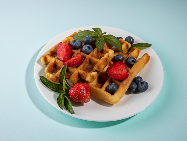 belgian waffles with strawberries and berries