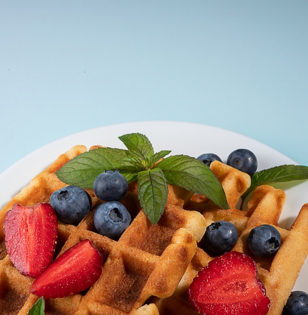 belgian waffles with strawberries and berries