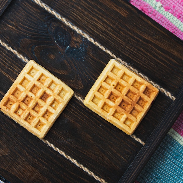 Belgian waffles on a wooden background