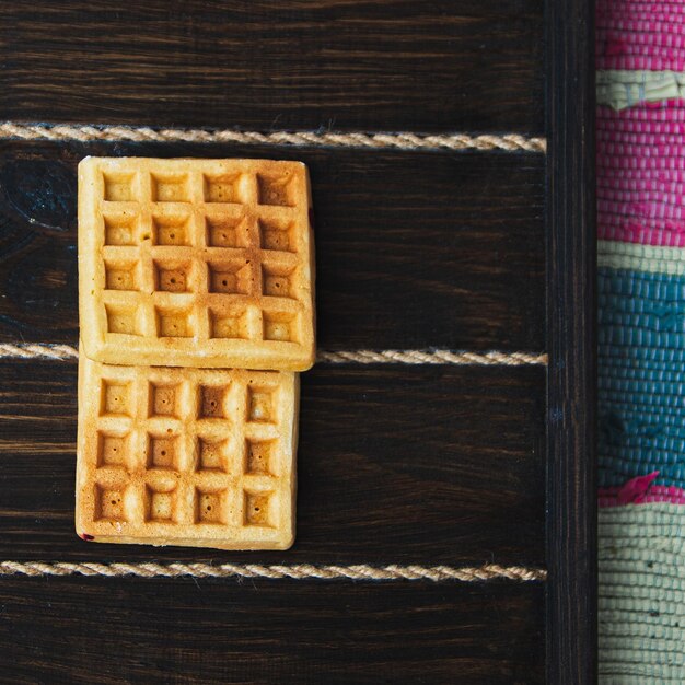 Belgian waffles on a wooden background