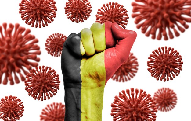 Belgium flag fist fighting off coronavius disease