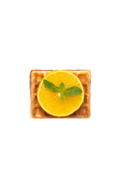 Photo belgium waffle with orange and mint on white isolated background