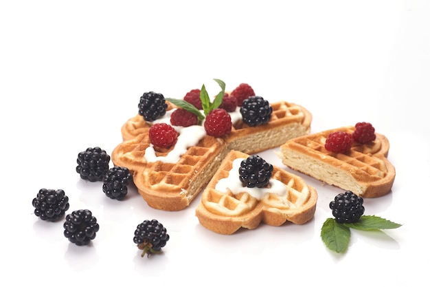 Belgium waffles with fresh berries isolated