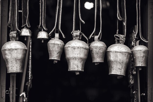 Photo the bell is in nepal a composition of bells in the temple closeup