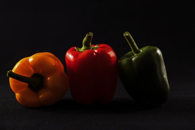 Bell peppers on black background paprika healthy eating vegetables vegetables for the restaurant