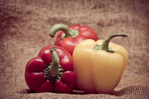 Bell peppers over vintage background