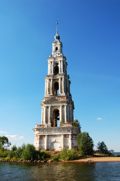 The bell tower of the flooded monastery on the Volga river