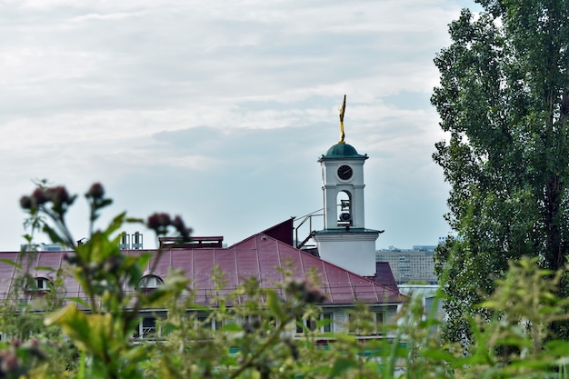 Bell tower of the Orthodox church against the blue sky