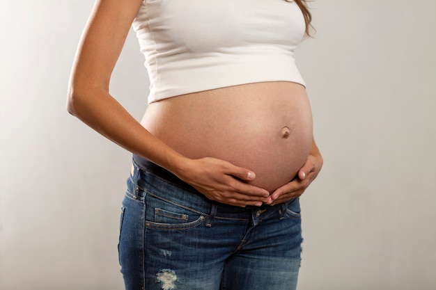 Belly of a pregnant woman in late