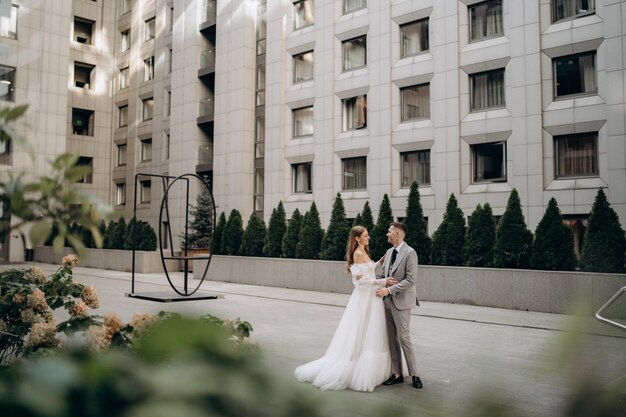 Beloved young couple getting married having wedding photoshoop