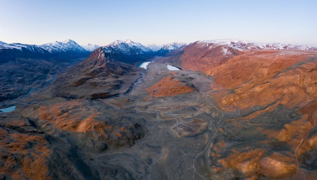 Beltirdu Mountain Ridge. Green Hills, Lakes and  River in Autumn at Sunrise. Aerial View. Kosh-Agachsky District, The Altai Mountains, Russia.