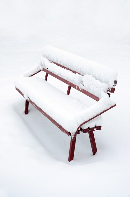 The bench, covered by a thick layer of a wall