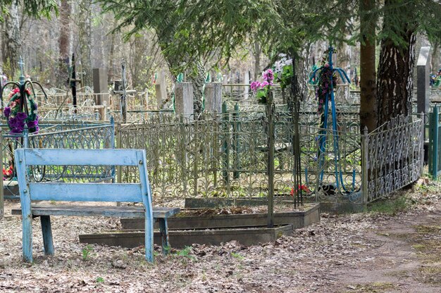 Bench near the graves Shop in the cemetery Visiting the deadFarewell to loved ones