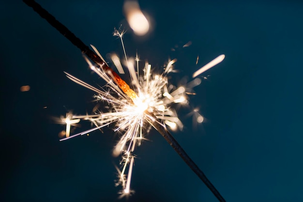 Bengal fire sparkles against the black background.