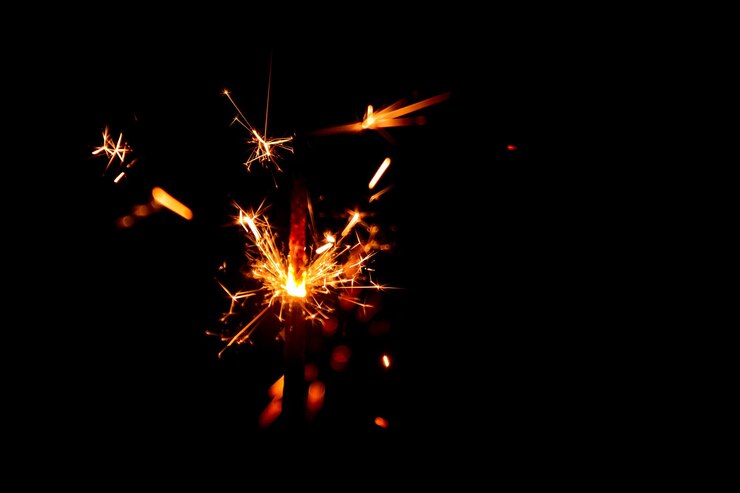 Bengal lights and fireworks in the dark. Background for New year or Christmas.