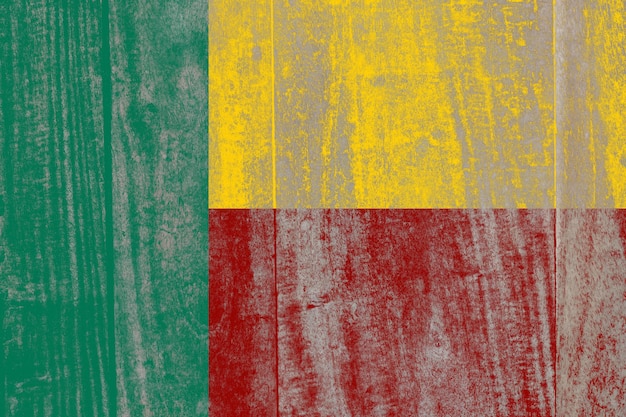 Benin flag painted on a damaged old wooden background